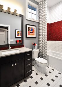 Bathroom in Michigan Home with White Tile Floors and Red Glass Tile Backsplash