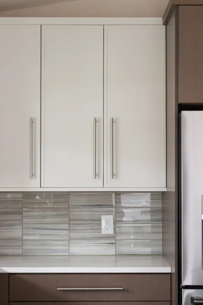 Modern Kitchen with a focus on upper cabinetry, lowers, tile, and hardware